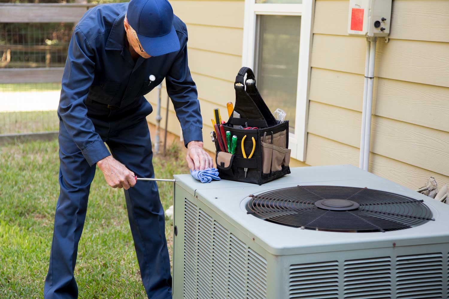 technician installing new heat pump