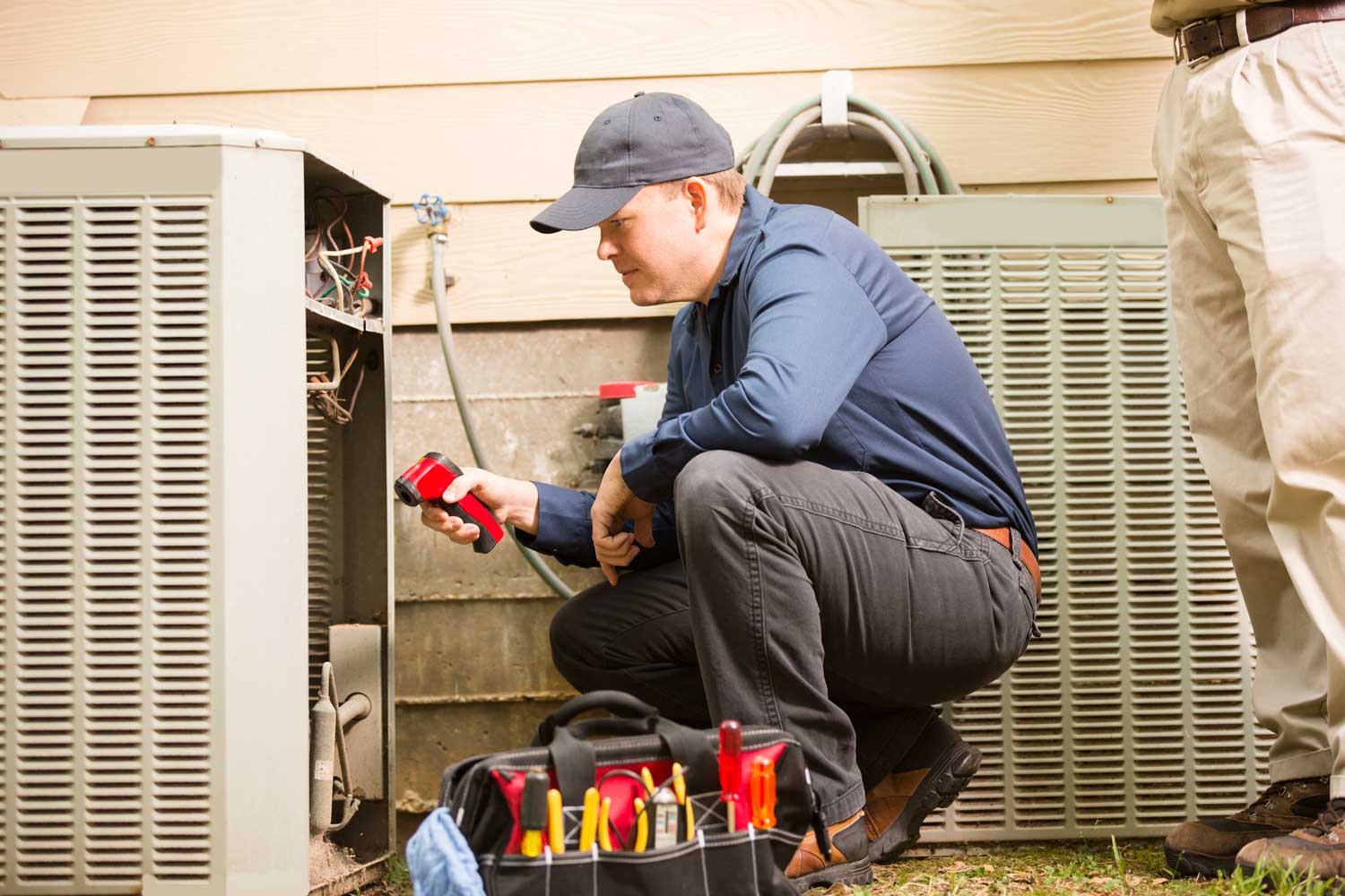 HVAC technician testing diagnostics