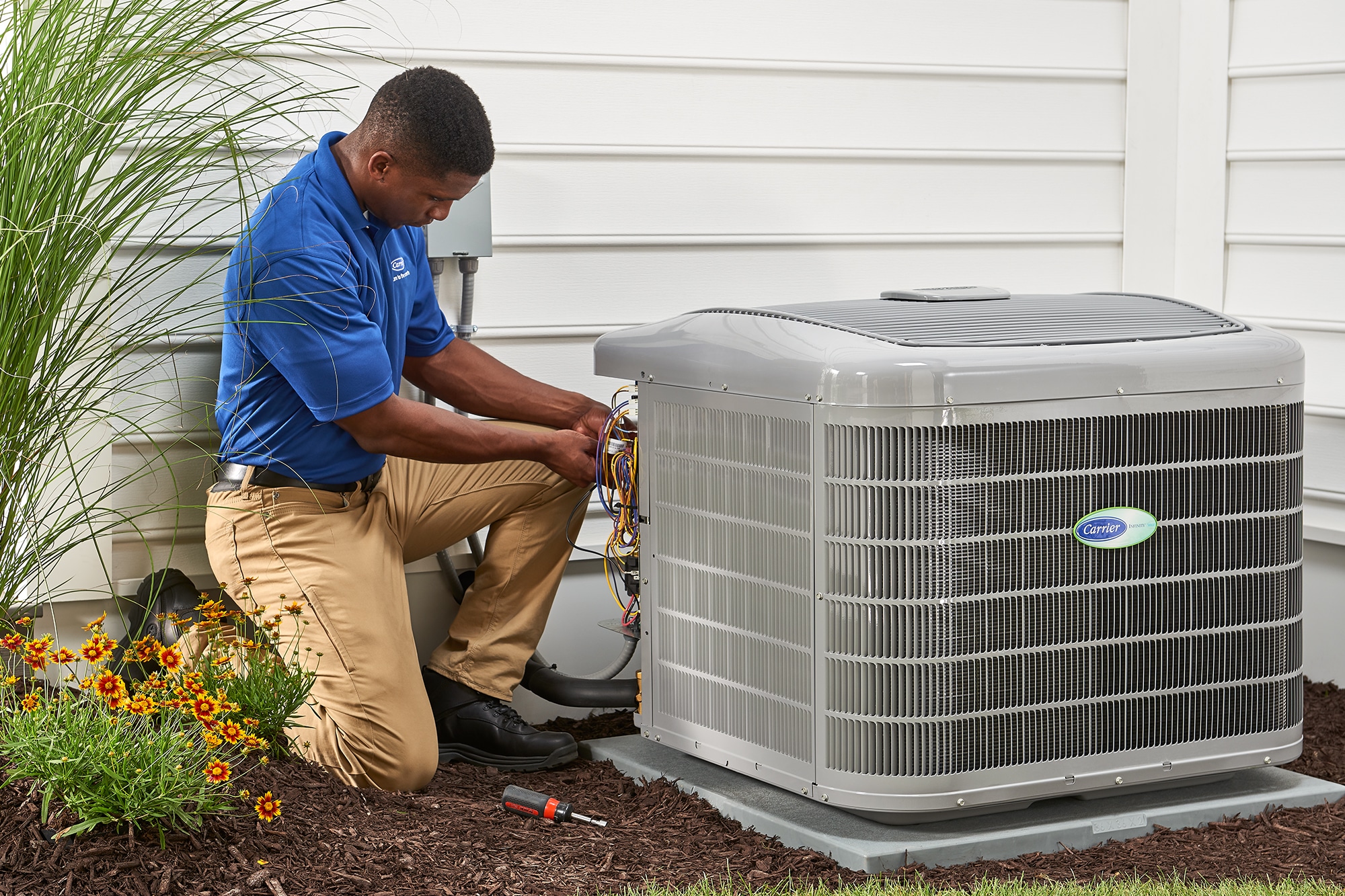 Carrier technician installing new HVAC unit