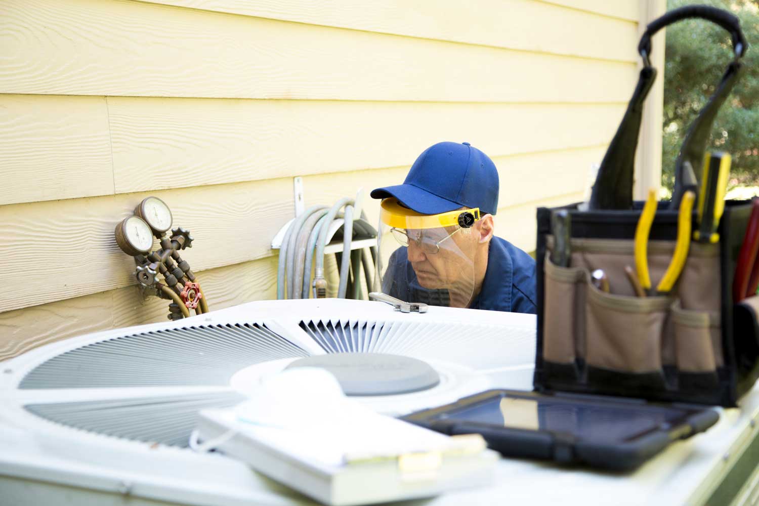 Technician removing HVAC system